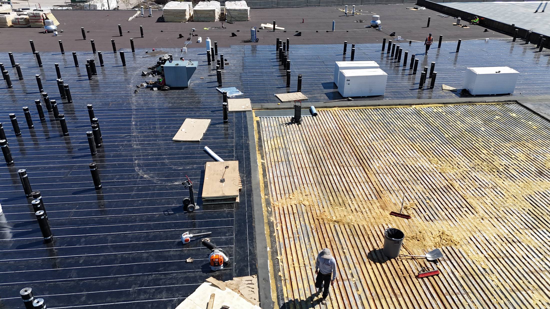 City Roofing crew installing a torch-on (SBS) flat roof in Calgary