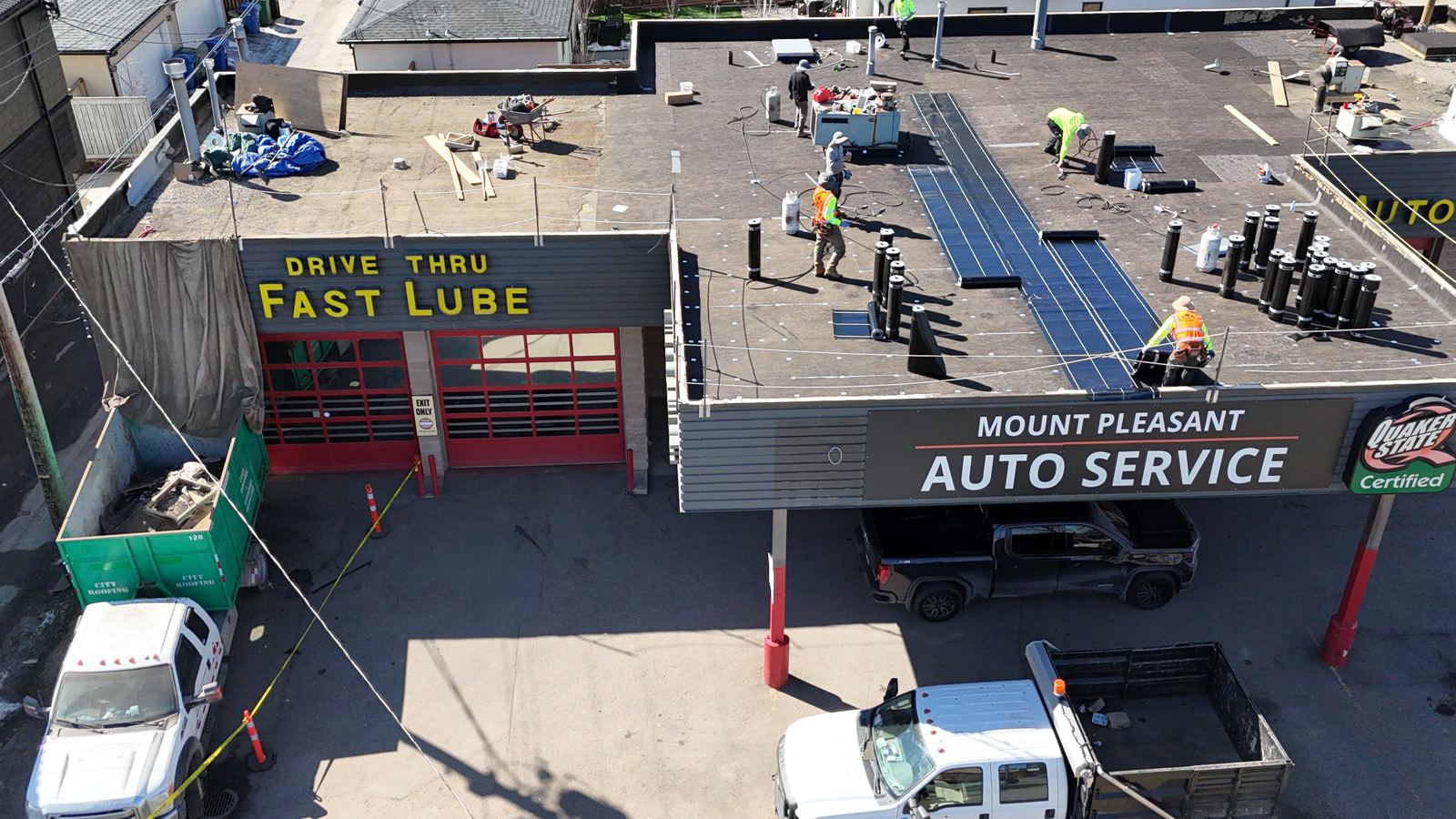 Auto service shop roof replacement in progress