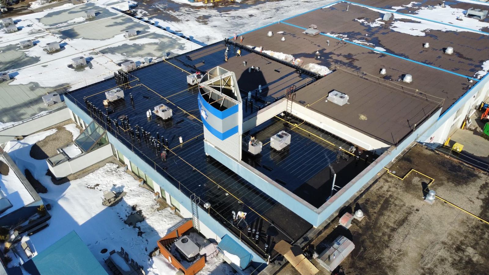 Commercial building with new roof membrane, seen from above