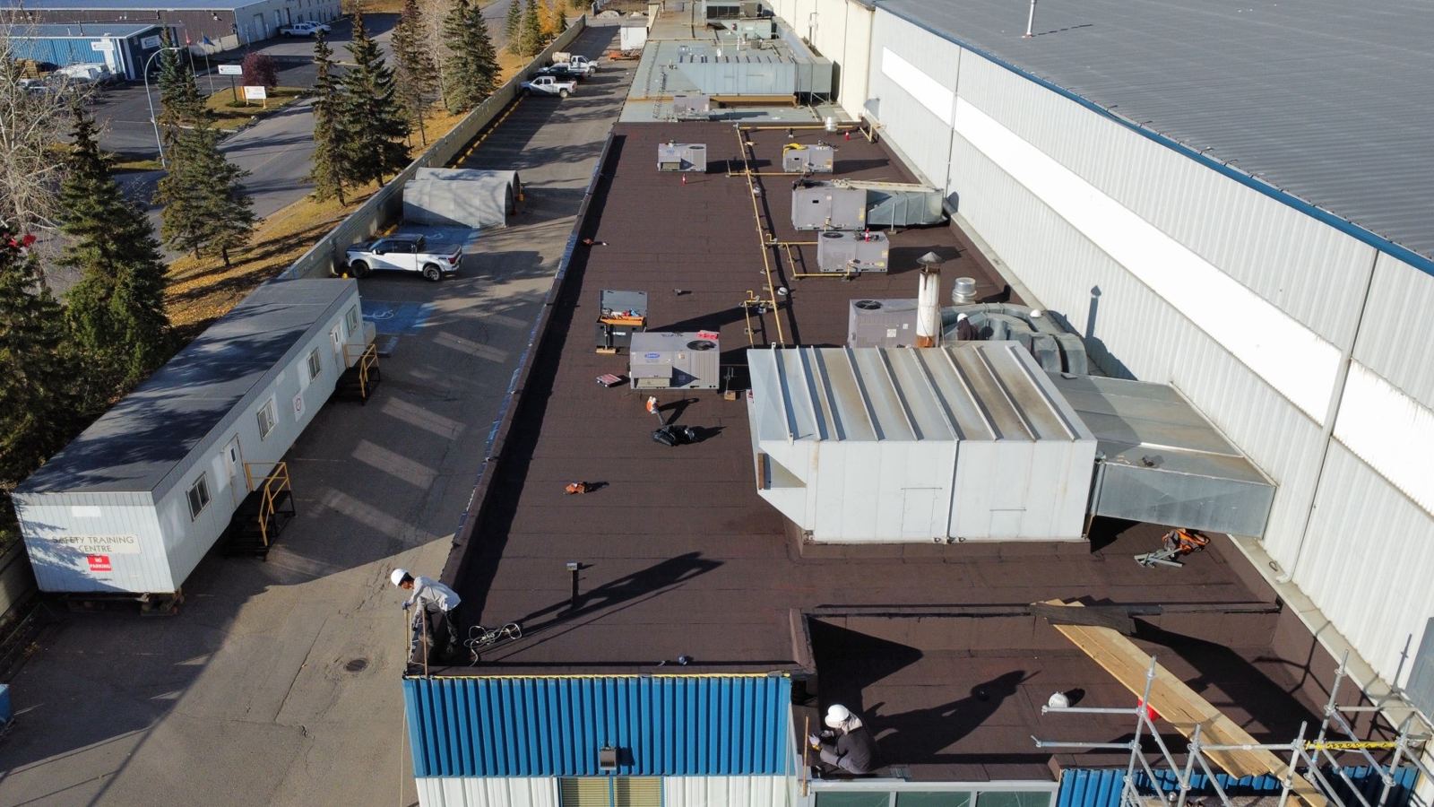 Long commercial building with a new flat roof