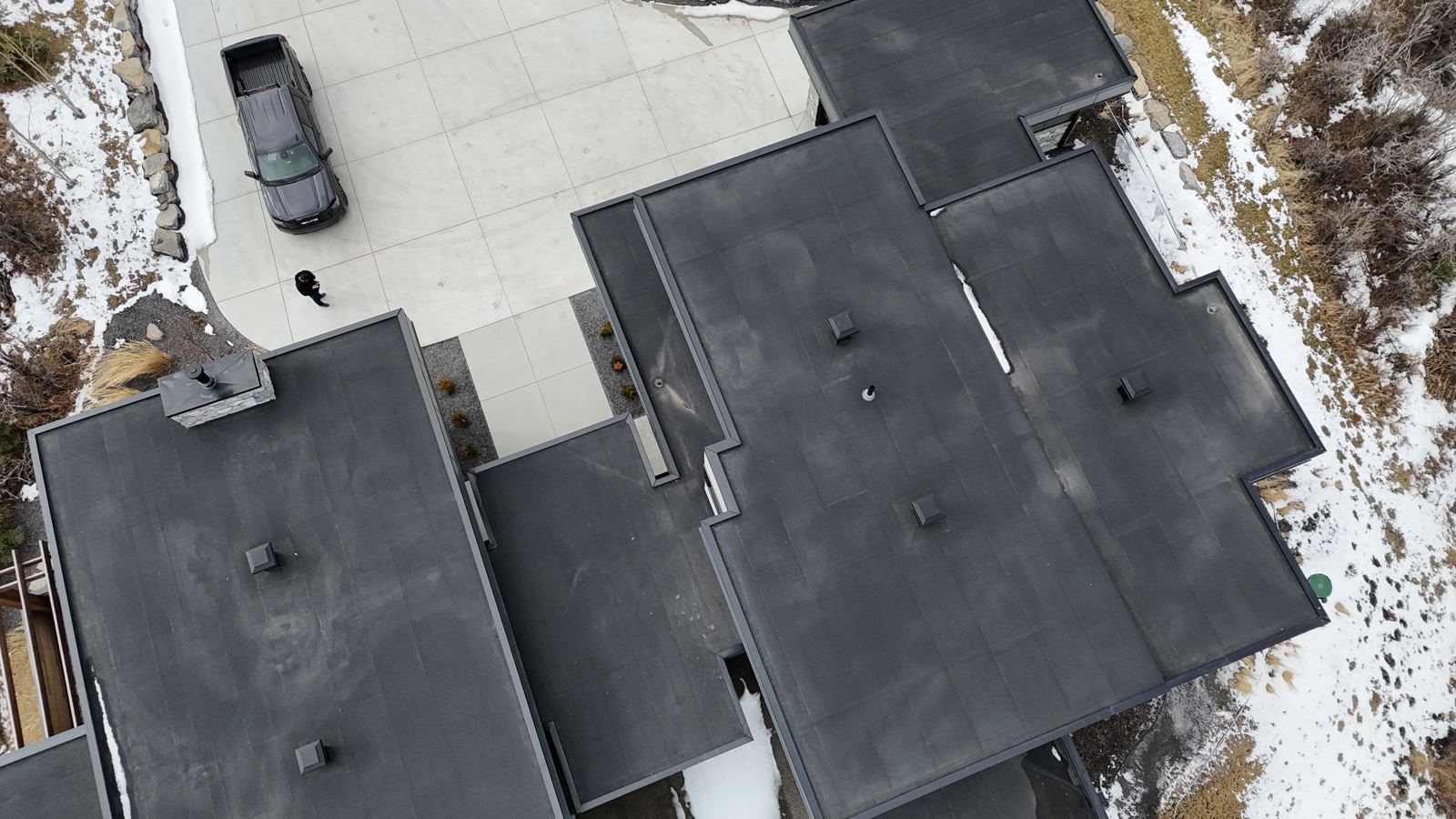 Drone view of the new flat roofs on a modern home
