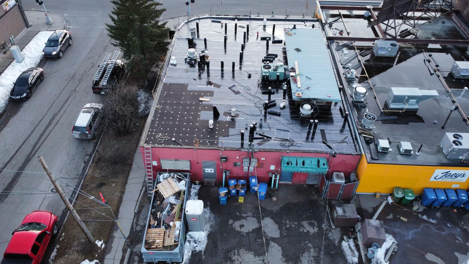 Retail strip roof replacement in progress