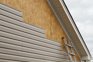New siding being installed onto a home