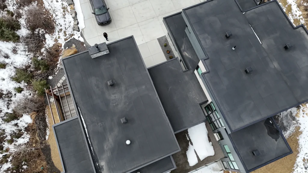 Aerial view of modern homes with new low-slope roofs